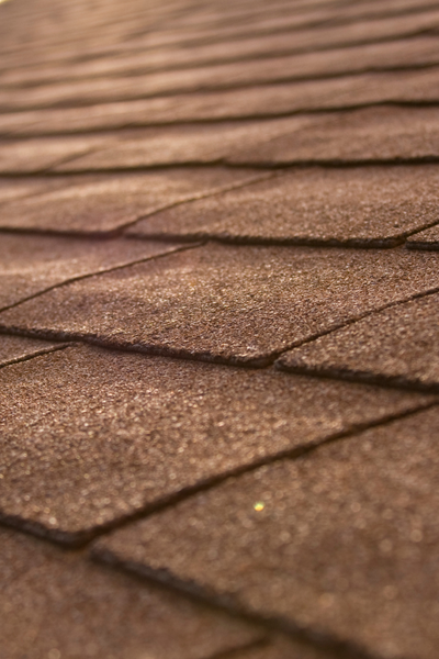 New brown roof shingles, for information on roof repair in Clayton, Raleigh, and Smithfield from Thurston Roof.