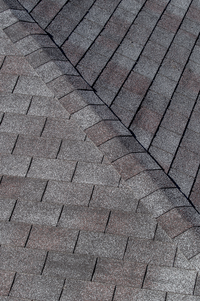 A rooftop seam and shingles, for information on Clayton Roofing from Thurston Roof