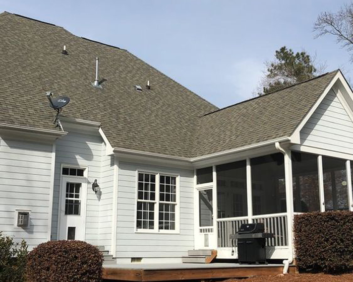 A house with a new roof from Raleigh Durham licensed roofer Thurston Roof